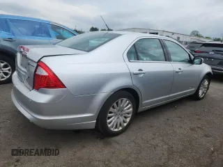 2012 Ford Fusion Hybrid z VIN 3FADP0L34CR227740, wystawiony jako Copart lot #64989475 z przebiegiem 134 862 mil mil oraz Szkoda całkowita • Salvage title. Historia ofert i sprzedaży dostępna na DreamBid. Obrazek 3.