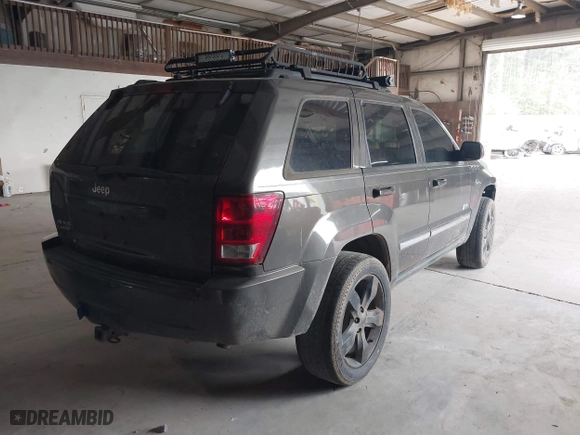 2006 Jeep Grand Cherokee Laredo with VIN 1J8GR48K76C280985, listed as a IAAI auction lot 42015127 with 257,358 mi miles. Bid and sale history available at carsss.com. Image 4.