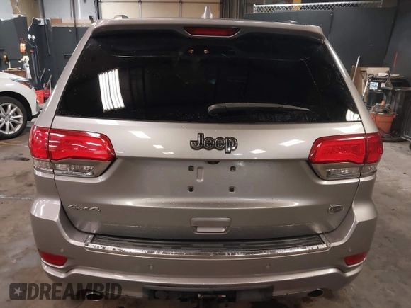 2015 Jeep Grand Cherokee Overland with VIN 1C4RJFCG1FC215426, listed as a IAAI auction lot 41689821 with 128,563 mi miles. Bid and sale history available at carsss.com. Image 17.