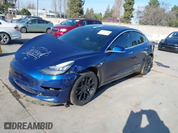 2018 Tesla Model 3 Long Range Battery with VIN 5YJ3E1EA4JF011799, listed as a IAAI auction lot 41765860 with 133,098 mi miles. Bid and sale history available at carsss.com. Image 19.