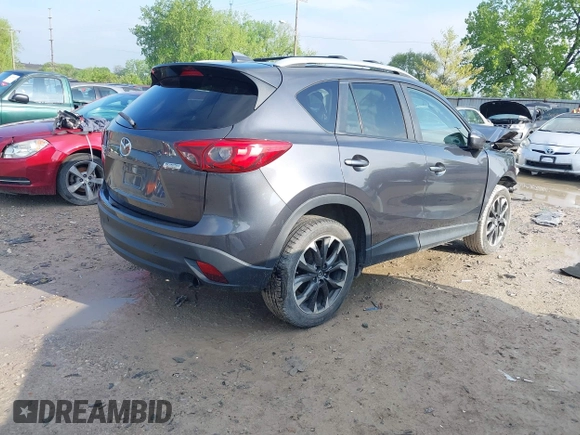 2016 Mazda CX-5 Grand Touring with VIN JM3KE4DYXG0724183, listed as a IAAI auction lot 42176009 with 152,695 mi miles and . Bid and sale history available at DreamBid. Image 4.