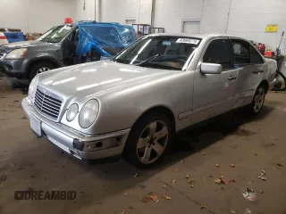 1999 Mercedes-Benz E-Class with VIN WDBJF82H4XX021888, listed as a Copart auction lot 83069274 with 173,198 mi miles and Salvage Title. Bid and sale history available at carsss.com. Image 1.