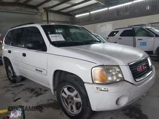 2004 GMC Envoy SLE with VIN 1GKDS13S642118163, listed as a IAAI auction lot 41809472 with 234,353 mi miles. Bid and sale history available at carsss.com. Image 1.