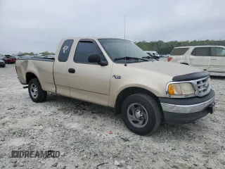 1999 Ford F-150 with VIN 1FTZX1721XNA37541, listed as a Copart auction lot 51588415 with 267,071 mi miles and Salvage title. Bid and sale history available at DreamBid. Image 4.