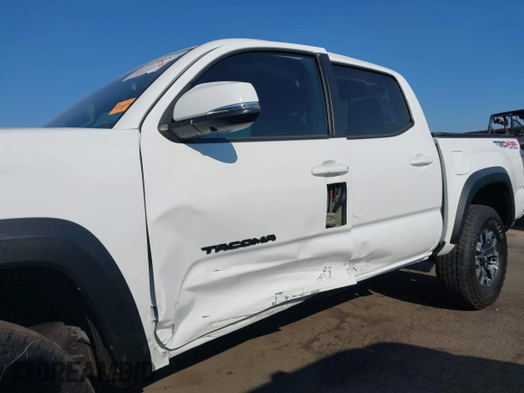 2023 Toyota Tacoma SR with VIN 3TMCZ5AN7PM630874, listed as a IAAI auction lot 40298041 with 8,635 mi miles and . Bid and sale history available at DreamBid. Image 6.