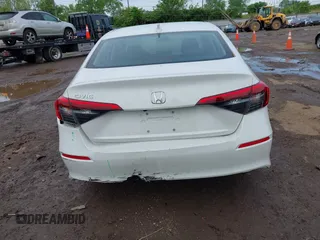 2024 Honda Civic LX z VIN 2HGFE2F20RH523593, wystawiony jako IAAI lot #42213468 z przebiegiem 13 561 mil mil oraz . Historia ofert i sprzedaży dostępna na DreamBid. Obrazek 6.