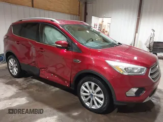 2017 Ford Escape Titanium z VIN 1FMCU9J9XHUC20359, wystawiony jako IAAI lot #41938688 z przebiegiem 79 743 mil mil oraz . Historia ofert i sprzedaży dostępna na DreamBid. Obrazek 6.