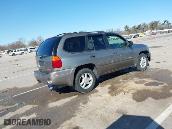 2005 GMC Envoy SLE z VIN 1GKDT13S252331044, wystawiony jako IAAI lot #41749219 z przebiegiem 263 876 mil mil oraz . Historia ofert i sprzedaży dostępna na DreamBid. Obrazek 4.