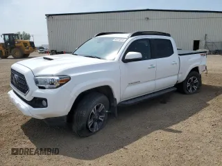 2018 Toyota Tacoma SR5 with VIN 5TFDZ5BN1JX034079, listed as a Copart auction lot 60570015 with 95,786 mi miles and Salvage title. Bid and sale history available at DreamBid. Image 1.