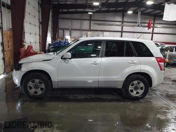 2011 Suzuki Grand Vitara Premium z VIN JS3TD0D24B4101861, wystawiony jako IAAI lot #41620401 z przebiegiem 151 034 mil mil oraz . Historia ofert i sprzedaży dostępna na DreamBid. Obrazek 14.