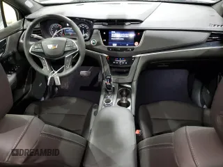 2025 Cadillac XT5 FWD Premium Luxury with VIN 1GYKNCRS9SZ120579, listed as a Copart auction lot 47656605 with 6,136 mi miles and Clean Title. Bid and sale history available at DreamBid. Image 8.