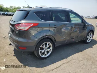 2015 Ford Escape Titanium z VIN 1FMCU9J97FUA38731, wystawiony jako Copart lot #60621085 z przebiegiem 119 704 mil mil oraz Szkoda całkowita • Salvage title. Historia ofert i sprzedaży dostępna na DreamBid. Obrazek 3.