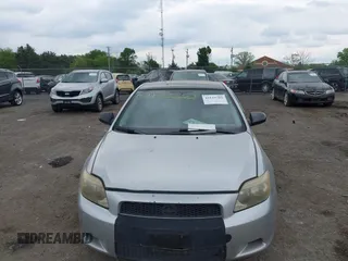 2005 Scion tC with VIN JTKDE177050032815, listed as a IAAI auction lot 42123702 with 228,973 mi miles. Bid and sale history available at carsss.com. Image 6.