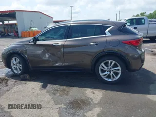 2019 Infiniti QX30 Luxe z VIN SJKCH5CP5KA012022, wystawiony jako IAAI lot #42088799 z przebiegiem 107 381 mil mil oraz . Historia ofert i sprzedaży dostępna na DreamBid. Obrazek 14.