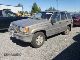 1995 Jeep Grand Cherokee Laredo with VIN 1J4FX58S1SC754691, listed as a Copart auction lot 72858214 with 251,234 mi miles and Salvage Title. Bid and sale history available at carsss.com. Image 1.