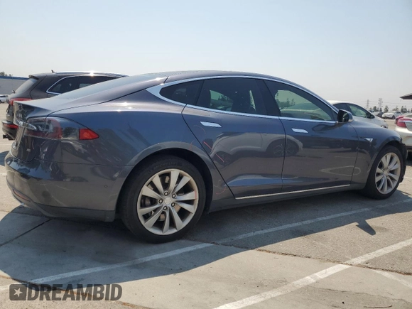 2014 Tesla Model S 60 z VIN 5YJSA1H11EFP64764, wystawiony jako Copart lot #64265815 z przebiegiem 126 191 mil mil oraz Szkoda całkowita • Salvage title. Historia ofert i sprzedaży dostępna na DreamBid. Obrazek 3.