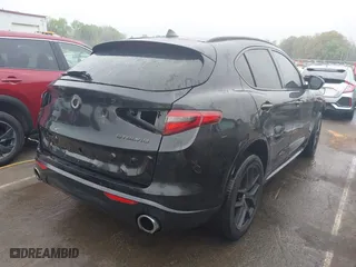 2021 Alfa Romeo Stelvio Ti with VIN ZASPAKBN9M7D09213, listed as a IAAI auction lot 41812289 with 38,410 mi miles. Bid and sale history available at carsss.com. Image 4.
