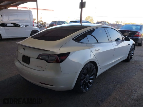 2021 Tesla Model 3 Performance with VIN 5YJ3E1EC4MF097993, listed as a IAAI auction lot 41366615 with 30,735 mi miles and . Bid and sale history available at DreamBid. Image 4.