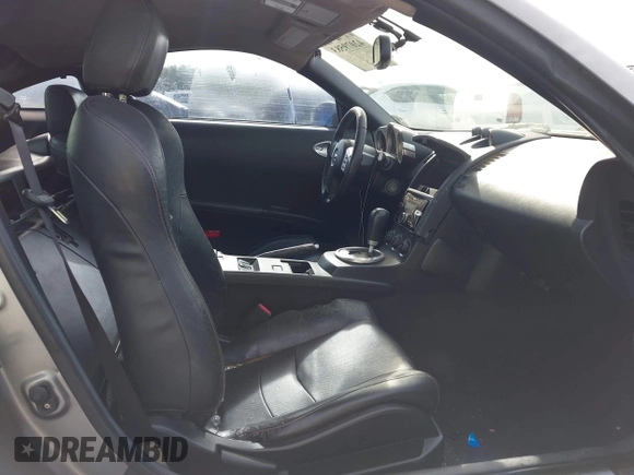2005 Nissan 350Z Enthusiast with VIN JN1AZ34D85M609056, listed as a IAAI auction lot 42079583 with 203,596 mi miles. Bid and sale history available at carsss.com. Image 5.