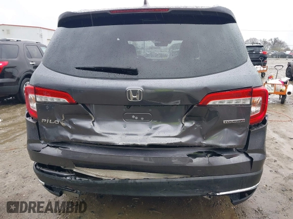 2021 Honda Pilot Touring 8-Passenger with VIN 5FNYF5H9XMB014190, listed as a IAAI auction lot 41749586 with 67,602 mi miles and . Bid and sale history available at DreamBid. Image 6.