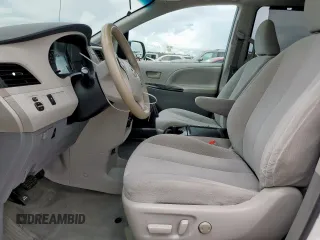 2014 Toyota Sienna LE AAS with VIN 5TDKK3DC1ES424249, listed as a Copart auction lot 62114525 with 193,301 mi miles and Salvage title. Bid and sale history available at DreamBid. Image 7.