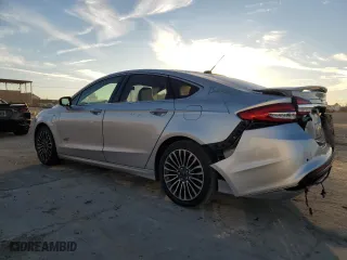2017 Ford Fusion Energi Titanium with VIN 3FA6P0SUXHR379807, listed as a Copart auction lot 84885494 with 100,735 mi miles and Salvage Title. Bid and sale history available at carsss.com. Image 2.