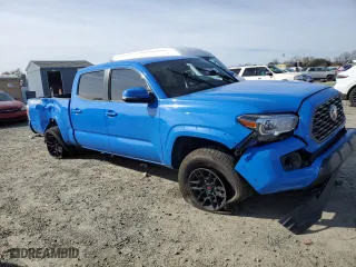 2021 Toyota Tacoma 4WD SR5 with VIN 3TMDZ5BN6MM112690, listed as a Copart auction lot 47038895 with 99,860 mi miles and Salvage Title. Bid and sale history available at carsss.com. Image 4.