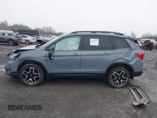 2022 Honda Passport Elite z VIN 5FNYF8H06NB015583, wystawiony jako IAAI lot #41633925 z przebiegiem 49 738 mil mil oraz . Historia ofert i sprzedaży dostępna na DreamBid. Obrazek 14.
