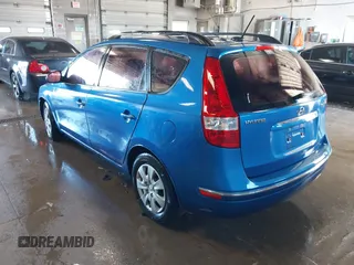 2010 Hyundai Elantra Touring SE with VIN KMHDC8AE8AU077884, listed as a IAAI auction lot 41833566 with 192,421 mi miles. Bid and sale history available at carsss.com. Image 3.