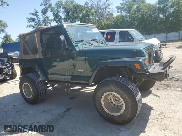 1999 Jeep Wrangler Sahara with VIN 1J4FY49S6XP478675, listed as a Copart auction lot 52147605 with 157,971 mi miles and Salvage Title. Bid and sale history available at carsss.com. Image 4.