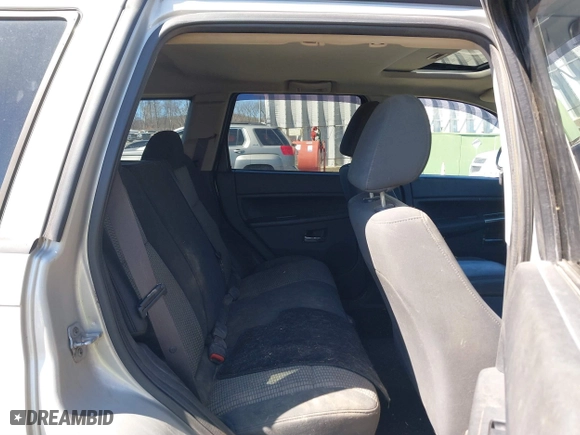 2010 Jeep Grand Cherokee Laredo with VIN 1J4PR4GK2AC125918, listed as a IAAI auction lot 41899078 with 236,229 mi miles. Bid and sale history available at carsss.com. Image 8.
