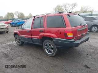 2004 Jeep Grand Cherokee Laredo with VIN 1J4GW48S94C151816, listed as a IAAI auction lot 41983332 with 151,227 mi miles. Bid and sale history available at carsss.com. Image 3.