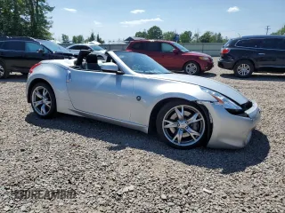 2012 Nissan 370Z Touring with VIN JN1AZ4FH3CM370910, listed as a Copart auction lot 65940005 with 23,009 mi miles and Salvage title. Bid and sale history available at DreamBid. Image 4.