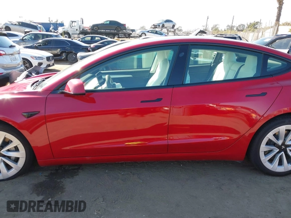 2021 Tesla Model 3 Long Range with VIN 5YJ3E1EBXMF990242, listed as a IAAI auction lot 41674222 with 24,554 mi miles and . Bid and sale history available at DreamBid. Image 14.
