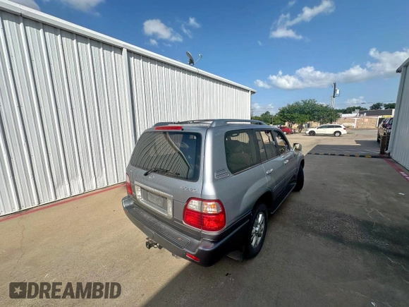 2003 Lexus LX 470 z VIN JTJHT00W933535214, wystawiony jako Copart lot #62037495 z przebiegiem 373 210 mil mil oraz Czysty tytuł • Clean title. Historia ofert i sprzedaży dostępna na DreamBid. Obrazek 4.