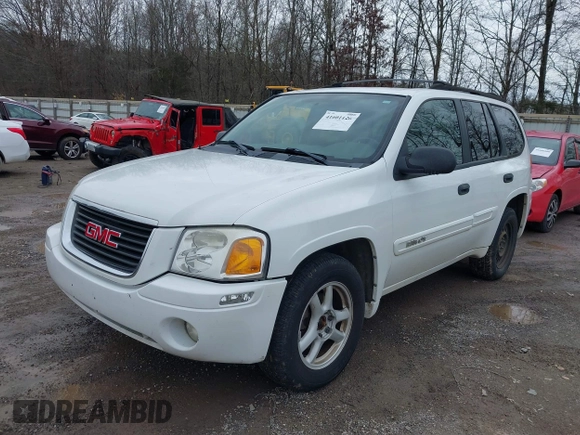 2004 GMC Envoy SLE with VIN 1GKDT13SX42357048, listed as a IAAI auction lot 41601126 with 304,101 mi miles. Bid and sale history available at carsss.com. Image 2.