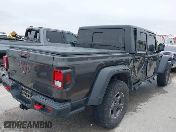 2020 Jeep Gladiator Rubicon with VIN 1C6JJTBG8LL135573, listed as a IAAI auction lot 41585896 with 79,070 mi miles and . Bid and sale history available at DreamBid. Image 4.