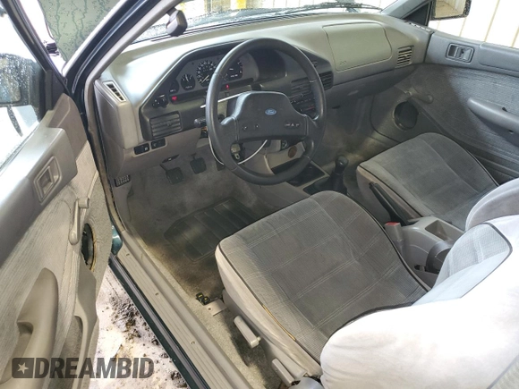 1996 Ford Escort z VIN 1FASP11J0TW123967, wystawiony jako Copart lot #52859835 z przebiegiem 164 693 mil mil oraz Szkoda całkowita • Salvage title. Historia ofert i sprzedaży dostępna na DreamBid. Obrazek 8.