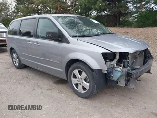 2014 Dodge Grand Caravan American Value with VIN 2C4RDGBG0ER168085, listed as a IAAI auction lot 42020959 with 213,383 mi miles and . Bid and sale history available at DreamBid. Image 1.