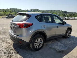 2014 Mazda CX-5 Sport with VIN JM3KE2BE7E0334880, listed as a Copart auction lot 61780635 with 96,926 mi miles and Salvage title. Bid and sale history available at DreamBid. Image 3.