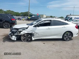 2018 Honda Civic EX-T z VIN 19XFC1F3XJE004123, wystawiony jako IAAI lot #42090933 z przebiegiem 81 228 mil mil oraz . Historia ofert i sprzedaży dostępna na DreamBid. Obrazek 14.