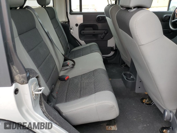 2007 Jeep Wrangler Unlimited X with VIN 1J4GA39117L169245, listed as a Copart auction lot 56731665 with 136,247 mi miles and Salvage title. Bid and sale history available at DreamBid. Image 11.