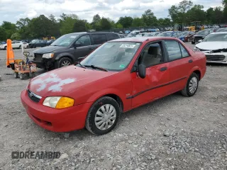1999 Mazda Protege DX z VIN JM1BJ2227X0183648, wystawiony jako Copart lot #55314825 z przebiegiem 68 335 mil mil oraz Szkoda całkowita • Salvage title. Historia ofert i sprzedaży dostępna na DreamBid. Obrazek 1.