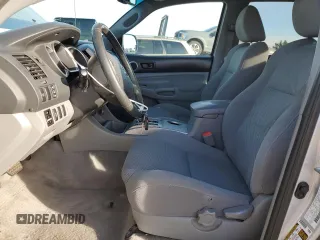 2011 Toyota Tacoma PreRunner with VIN 3TMJU4GN7BM114871, listed as a Copart auction lot 87256214 with 214,236 mi miles and Salvage Title. Bid and sale history available at DreamBid. Image 7.