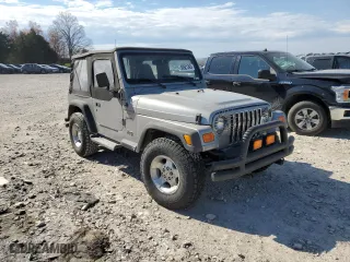 2000 Jeep Wrangler Sport with VIN 1J4FA49S4YP789348, listed as a Copart auction lot 50521365 with 0 mi miles and Salvage Title. Bid and sale history available at carsss.com. Image 4.