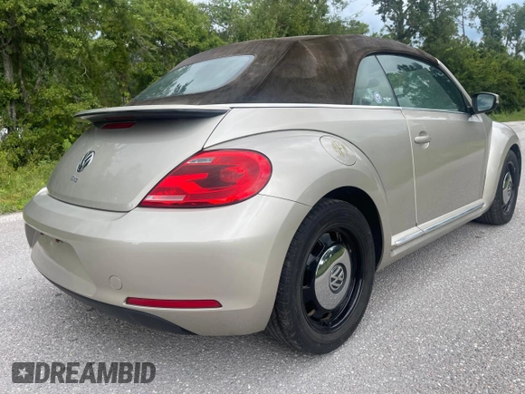 2013 Volkswagen Beetle 2.5L with VIN 3VW5X7AT2DM825928, listed as a Copart auction lot 66500855 with 48,795 mi miles and Salvage title. Bid and sale history available at DreamBid. Image 4.