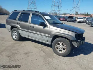1999 Jeep Grand Cherokee Laredo with VIN 1J4GW58NXXC623753, listed as a IAAI auction lot 41685540 with 190,134 mi miles. Bid and sale history available at carsss.com. Image 1.