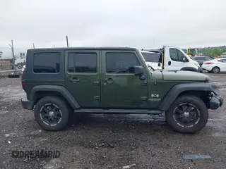 2007 Jeep Wrangler Unlimited X with VIN 1J4GA39127L231378, listed as a IAAI auction lot 42252475 with 152,568 mi miles and . Bid and sale history available at DreamBid. Image 14.