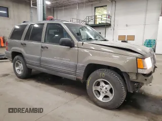 1998 Jeep Grand Cherokee Laredo with VIN 1J4GZ58S3WC207166, listed as a Copart auction lot 84243704 with 124,084 mi miles and Salvage Title. Bid and sale history available at carsss.com. Image 4.