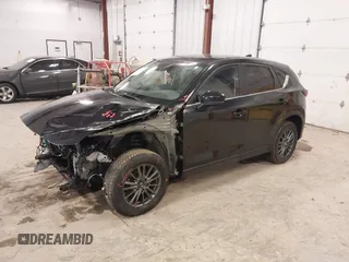 2021 Mazda CX-5 Touring with VIN JM3KFBCM1M1380409, listed as a IAAI auction lot 41677537 with 55,319 mi miles. Bid and sale history available at carsss.com. Image 17.